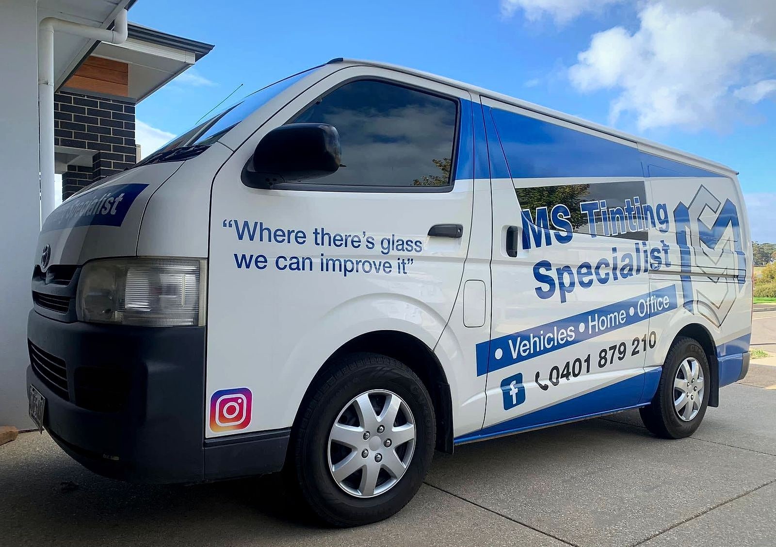 The MS Tinting Specialist van with tinted windows parked outside a modern Mount Barker home
