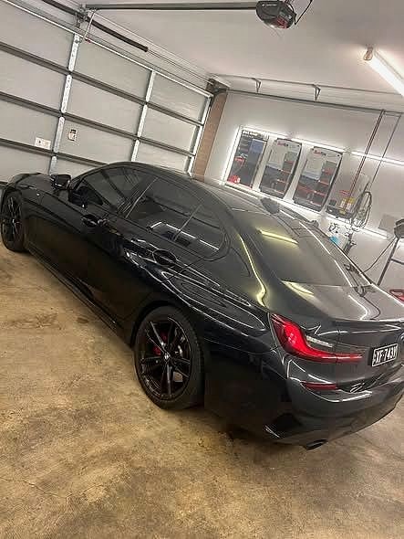 A black BMW with 20% tint all round